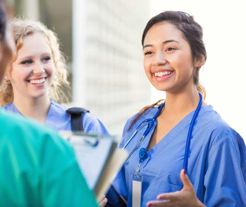 Nurse talking with other nurses 