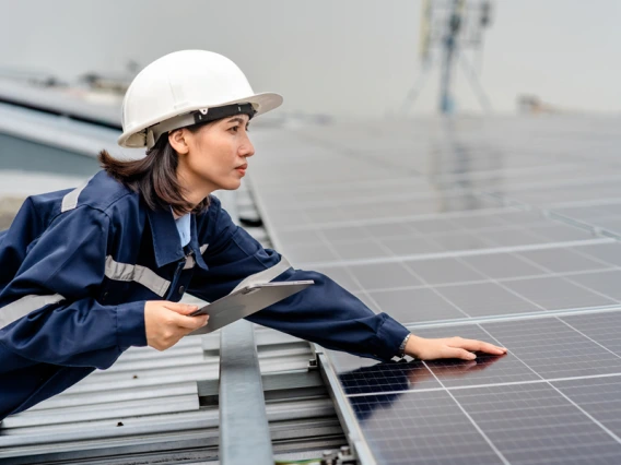 Bio engineer running testing on solar energy panels