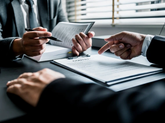 Client reviewing a contract with an attorney