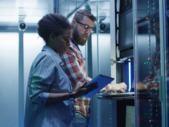 Systems engineers working with mainframe computers