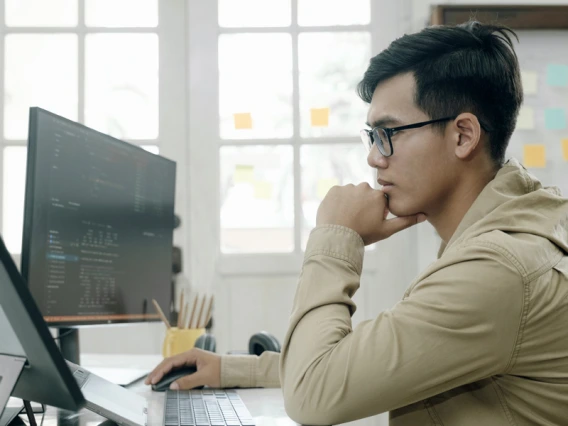 Systems engineer working with code
