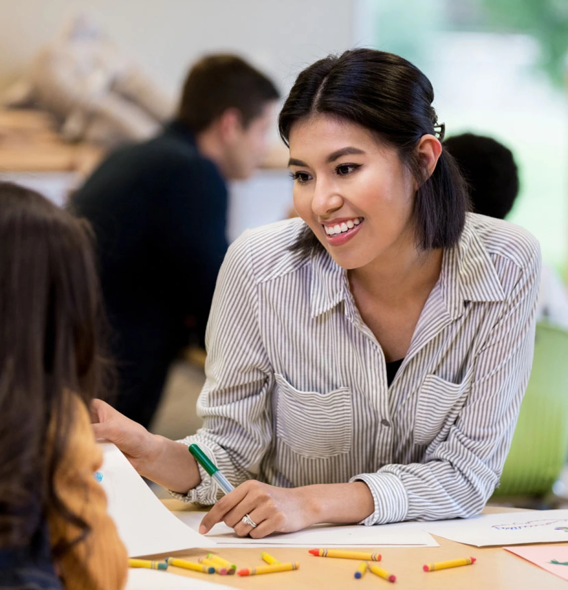 teacher showing a student a drawing